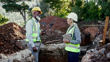 construction workers discussing plans on site