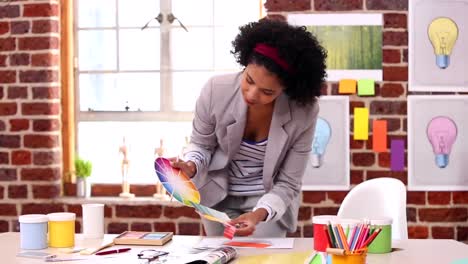 Pretty-designer-working-at-her-desk