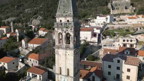 Cinematic-Orbiting-Shot-Above-Church-in-Perast,-Montenegro-on-Bay-of-Kotor