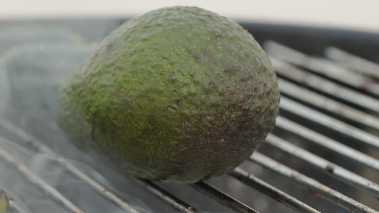 Grilled Banana on fire, latin american vegan grill with avocado and pepper, thai or Ecuadorian Street food. African traditional food on grill.