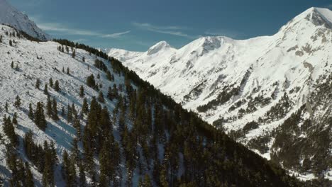 snowy ski slopes winter landscape in bulgaria mountains, aerial