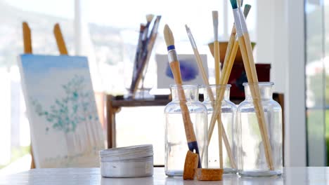 various paintbrush in glass container