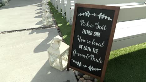 beautiful outdoor wedding dã©cor with a seating sign at le belvã©dã¨re events center in wakefield, quebec