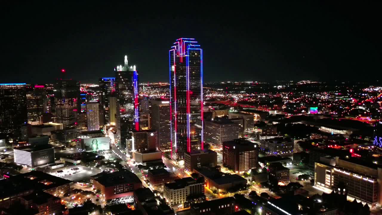 Aerial view of Dallas skyline above busy nighttime street
