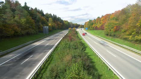 speed at the highway - fast driving car rushing over a german highway