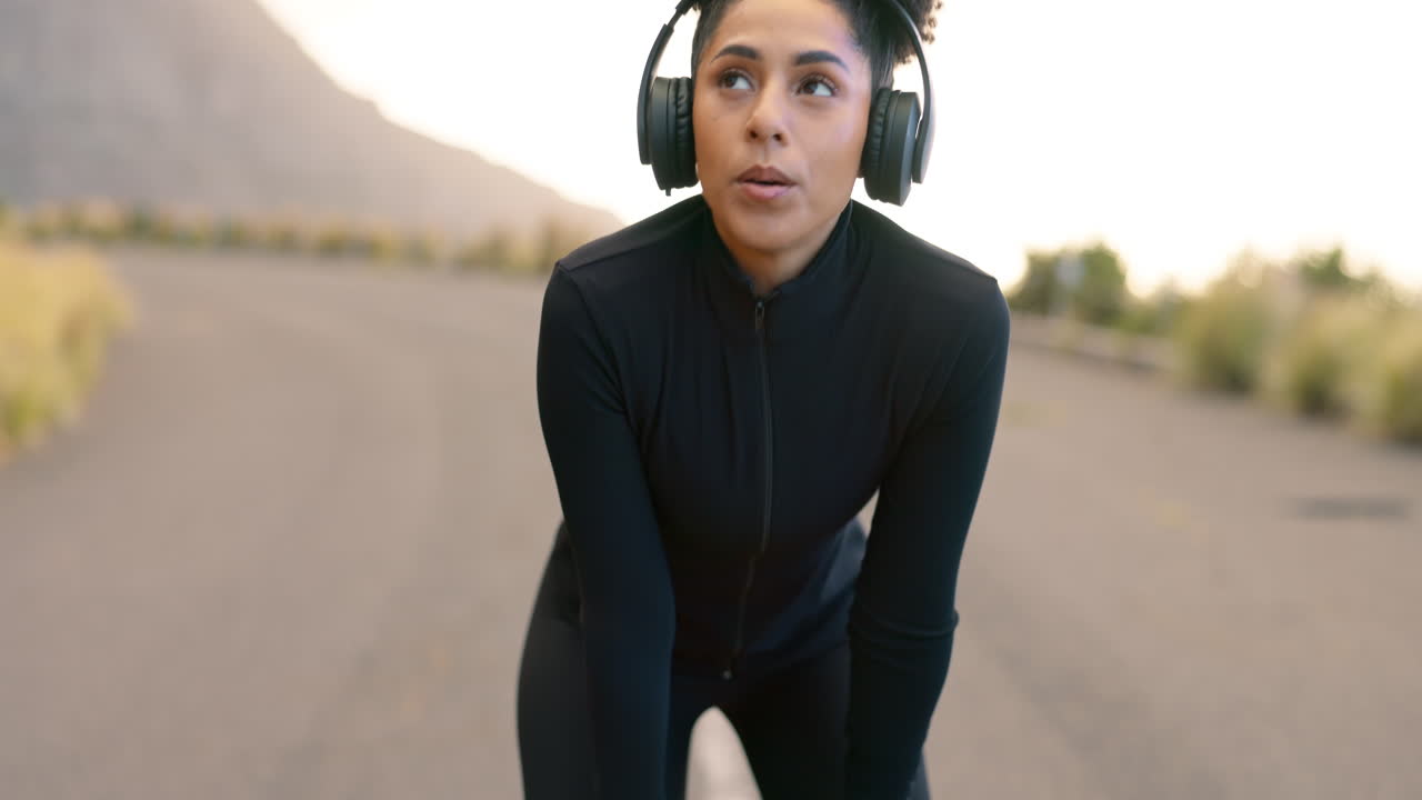 Mountain, fitness and woman tired from running