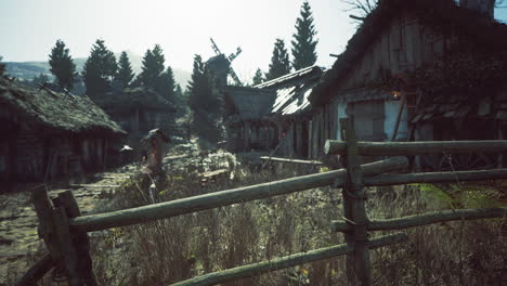 serene village landscape with rustic houses and a windmill during daylight