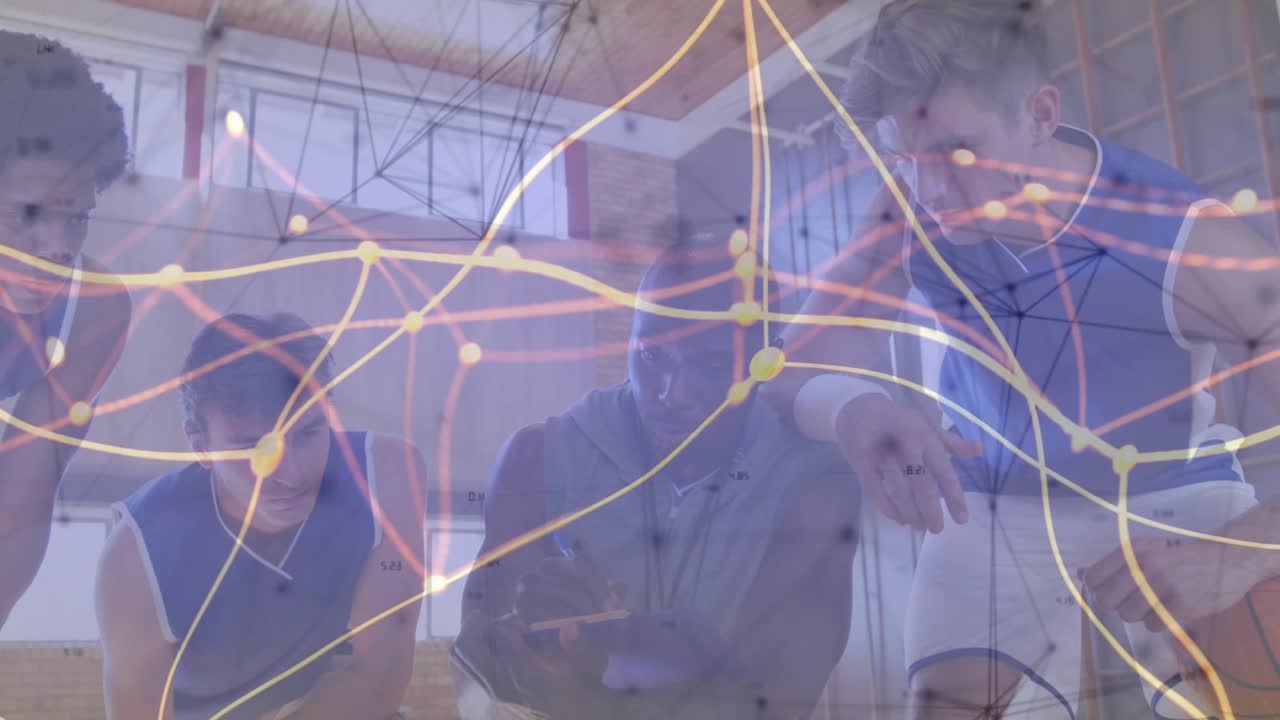 Coach tapping tablet and leading basketball huddle on court animated network overlay showing plays