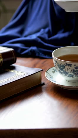 books and tea on a wooden table