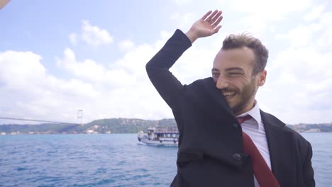 successful businessman clasps hands with his friend.