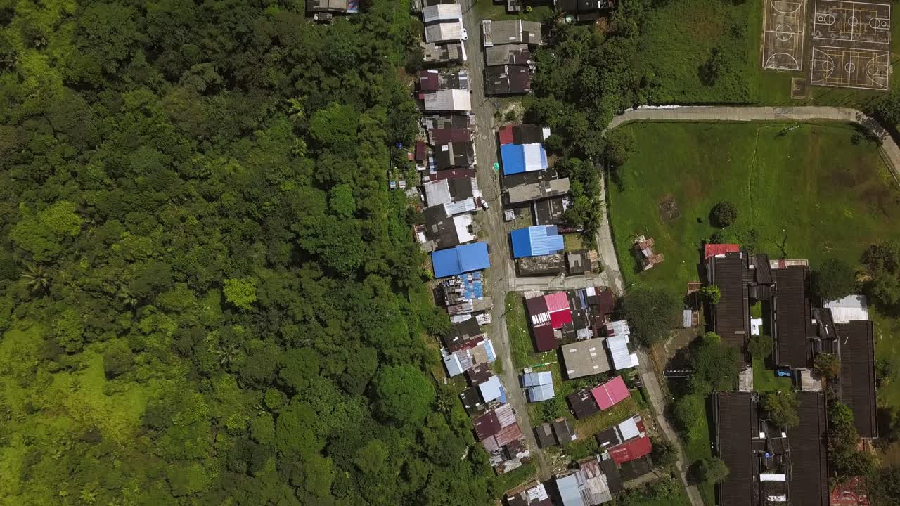 Aerial top shot over suburban street in Buenaventura, Colombia
