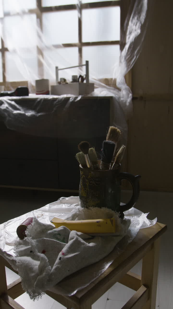 Paintbrushes and painting tools in a studio