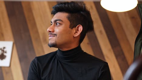 handsome sri lankan man looking confident and smiling, portrait view