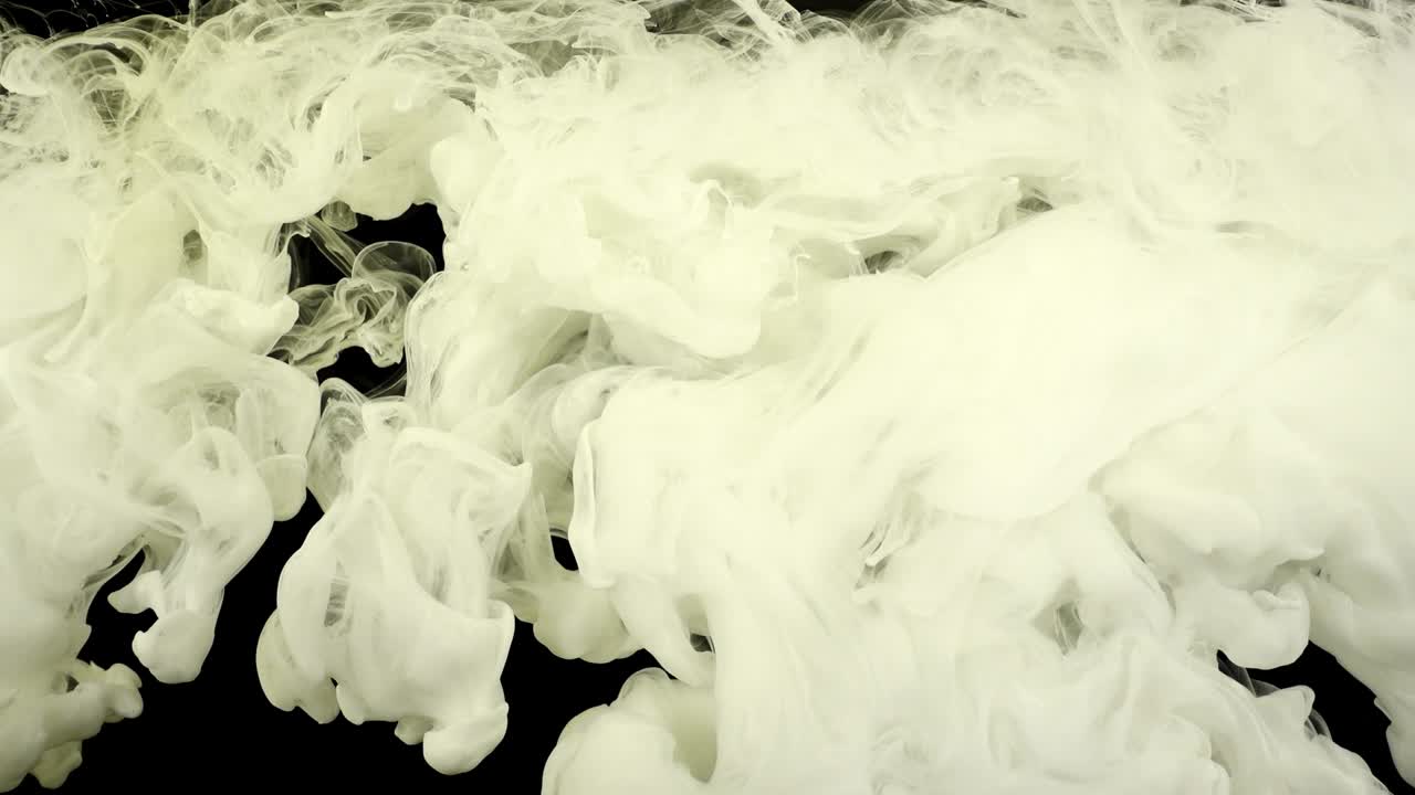 Abstract forms. Shooting on a black background. Mixing of paints