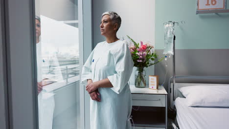 sad, woman and thinking at window in hospital