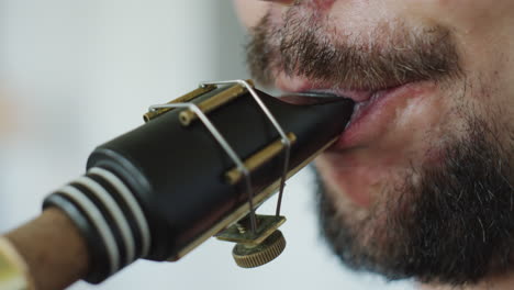 close-up of a person playing a woodwind instrument