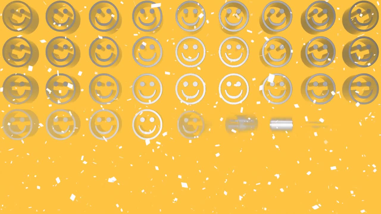 노란색 배경에 있는 금속 스마일리 얼굴 이모티의 줄에 떨어지는  ⁇  콘페티의 애니메이션