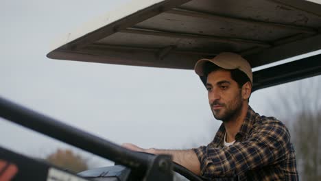 farmer driving a tractor