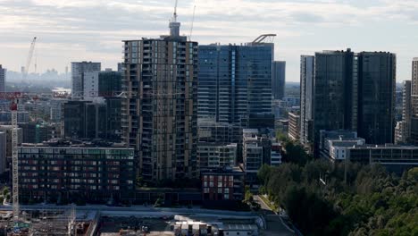 Urban-Evolution:-Modern-Skyscrapers-Adorning-the-Riverside-with-a-Glimpse-of-the-Distant-Urban-Silhouette