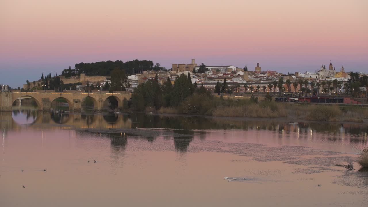 Badajoz city at sunset with river Guadiana in Spain