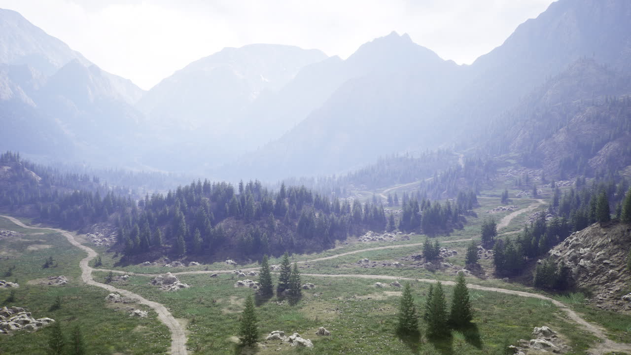 Breathtaking mountain landscape with winding trails and lush greenery at dawn