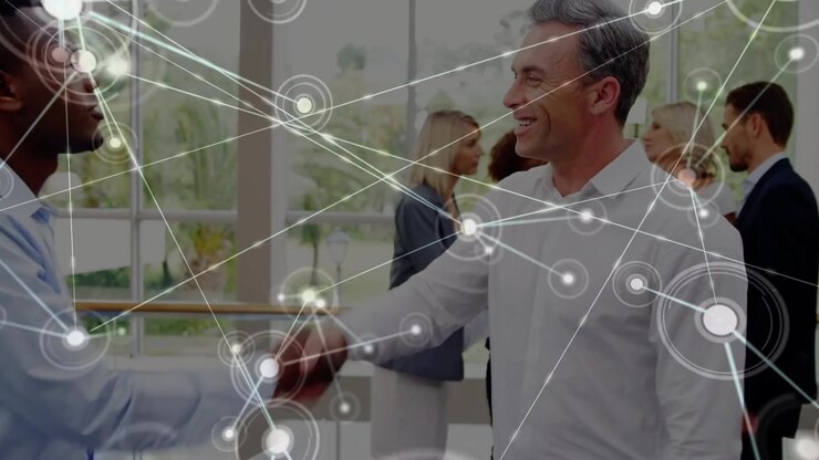 Business Professionals Collaborating and Shaking Hands in Modern Office