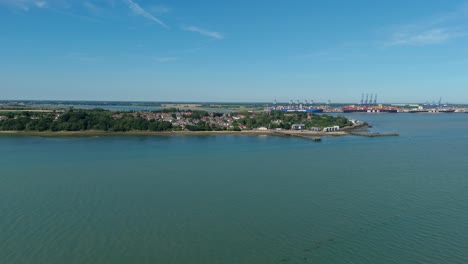 high angle drone view of the busy shotley marina, sailboats, and harbour landscape, sunny day over seaside suffolk town in southern england
