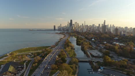 cars driving on lake shore drive in chicago during fall sunset