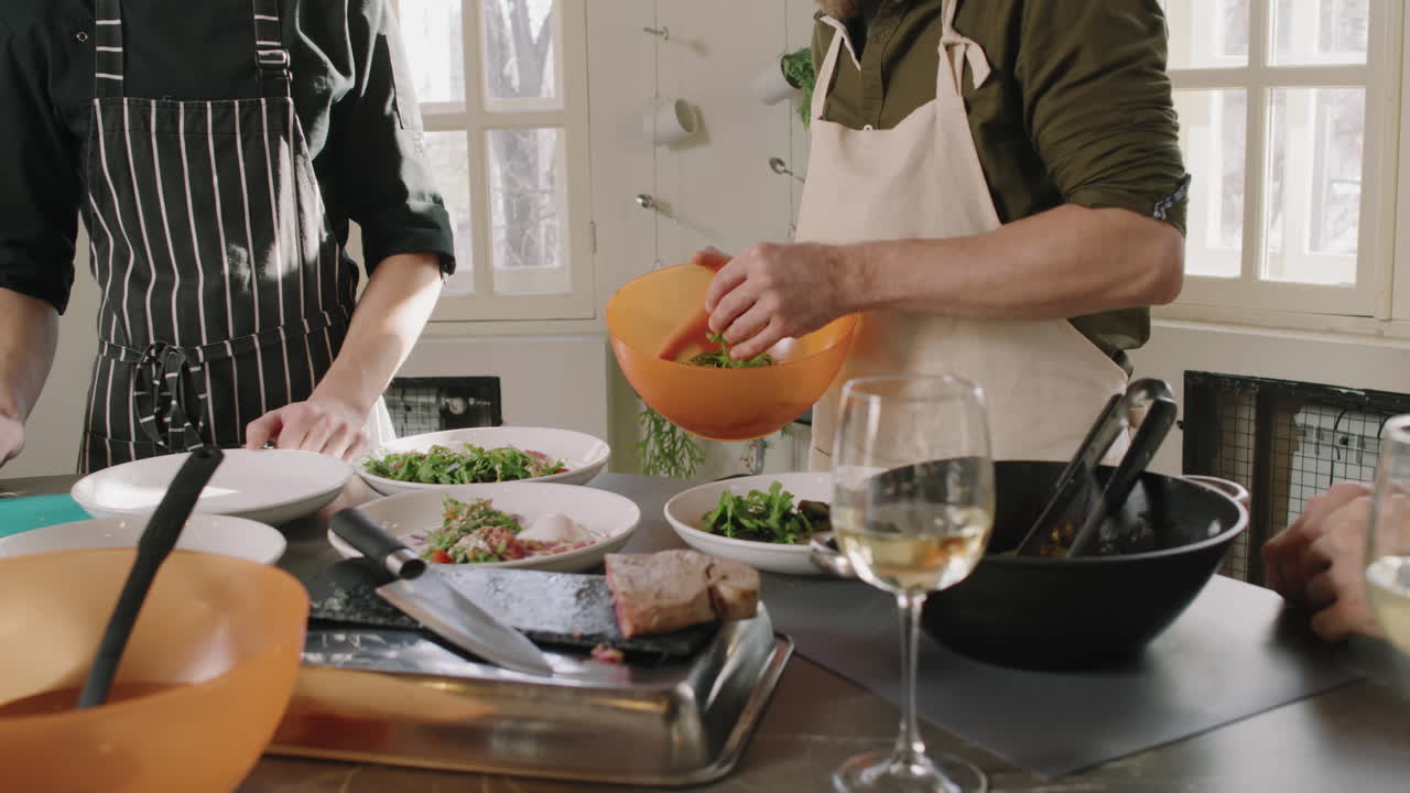 People cooking salad in a kitchen