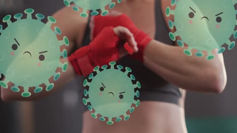 animation of virus cells over midsection of caucasian woman preparing for boxing