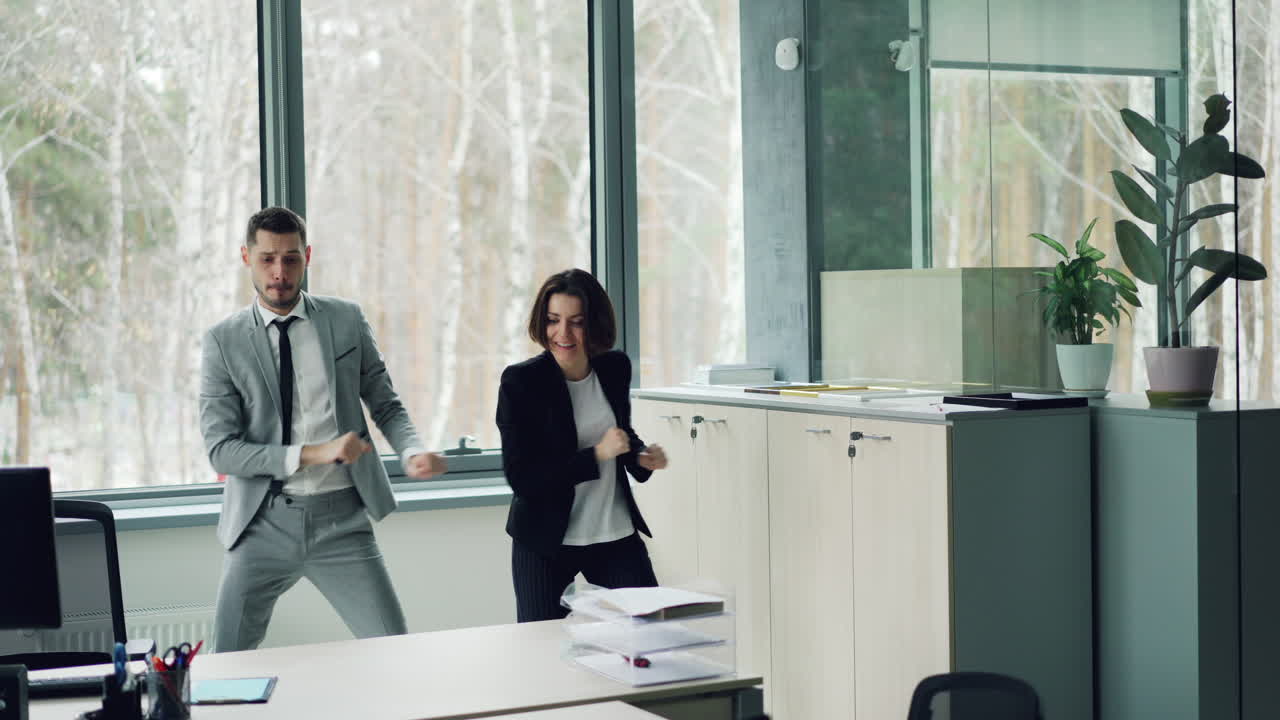 Happy Business People Dancing in Office