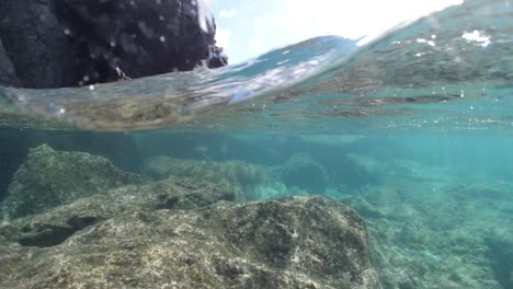 split water and rocky beach shot in the british virgin islands