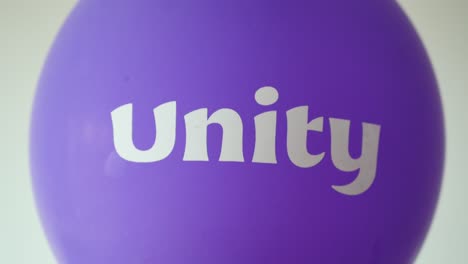 unity text on a purple  ballon