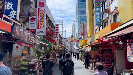 bustling tokyo street market with vibrant signage and shoppers under a sunny sky