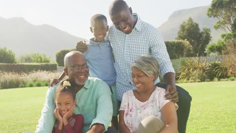 video of happy african american family spending time together in the garden