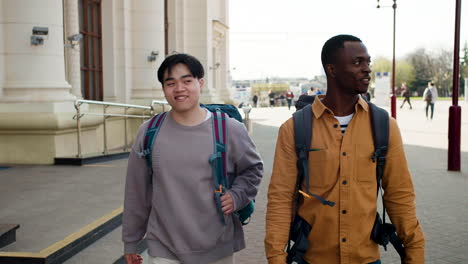 friends walking towards the train station