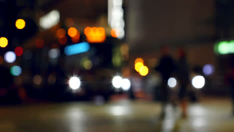 Colorful-bokeh-of-vehicle-lights-at-traffic-signal-on-street-at-night-4k