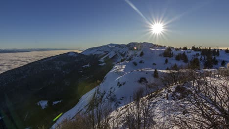 Beautiful-winter-mountain-sunset-timelapse-with-blue-sky-and-sea-of-clouds