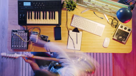 musician working in a home recording studio