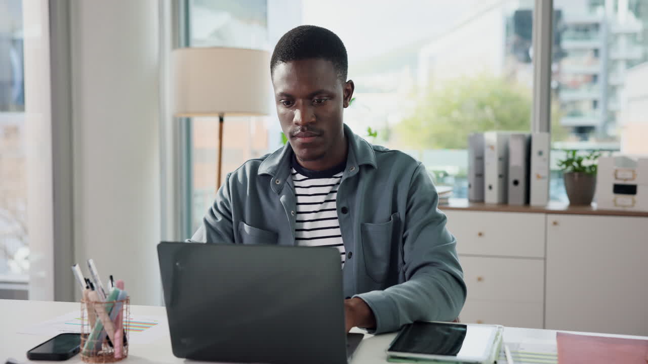 Man working on laptop in office