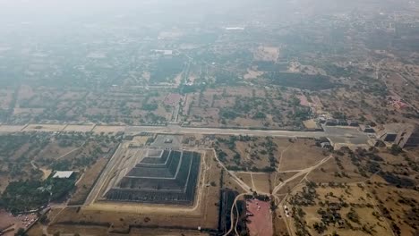 high-altitude shot of the teotihuacan archaeological site, on the outskirts of mexico city, showcasing the pyramid of the sun, of the moon, and the avenue of the dead. important pre-hispanic center