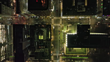 portland oregon aerial v117 cinematic vertical top down view drone flyover along sw broadway capturing illuminated downtown cityscape at night from above - shot with mavic 3 cine - august 2022