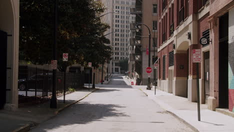 empty city alleyway with parking signs
