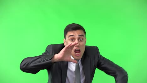 man in suit shouting and calling out on green screen