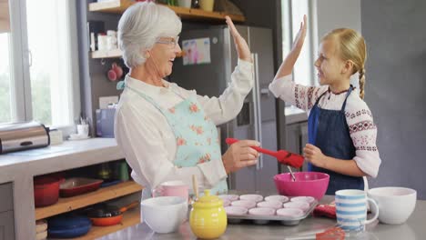 Grandmother-and-granddaughter-giving-high-five-4k