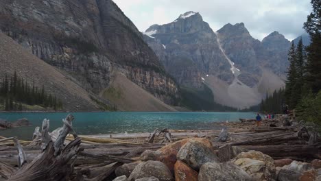 Moraine-lake-mountains-with-tourists-Alberta-Canada-pan