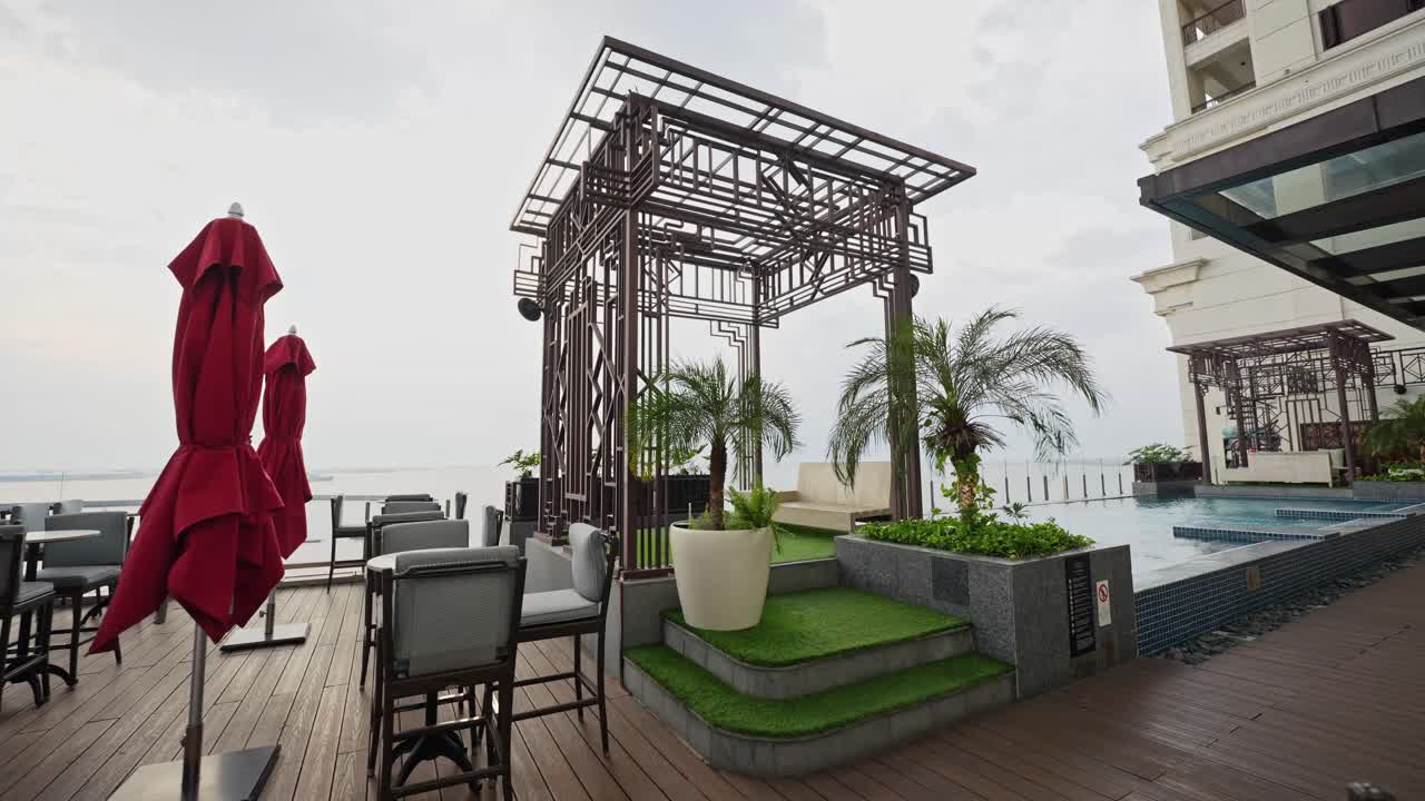 A stunning shot captures a luxurious rooftop terrace, offering breathtaking views, elegant decor, and a serene ambiance under the open sky.