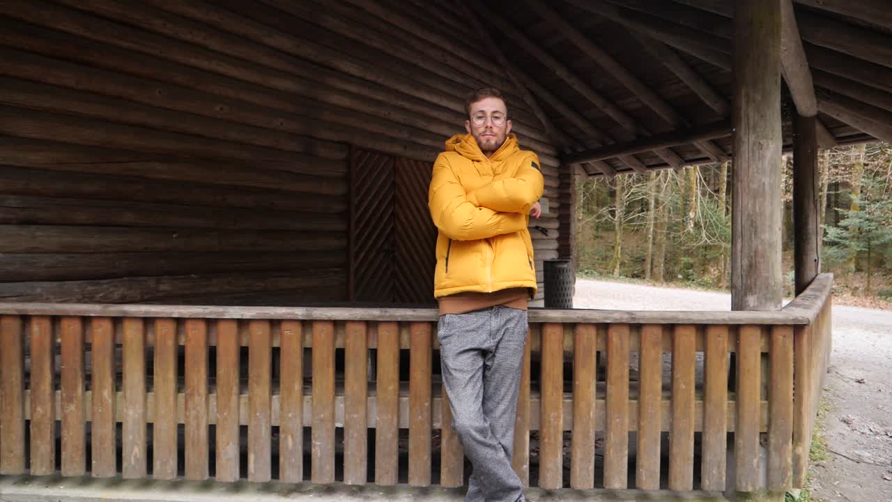 Dolly push portrait of a young confident male with bright yellow jacket