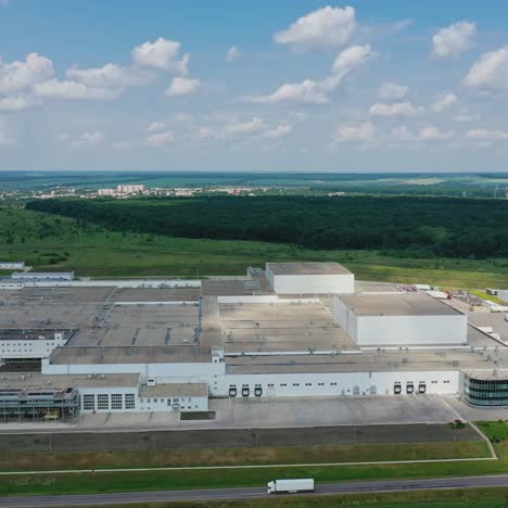 panoramic view of industrial zone on fields. large territory of modern factory on green nature background in the countryside. aerial view.