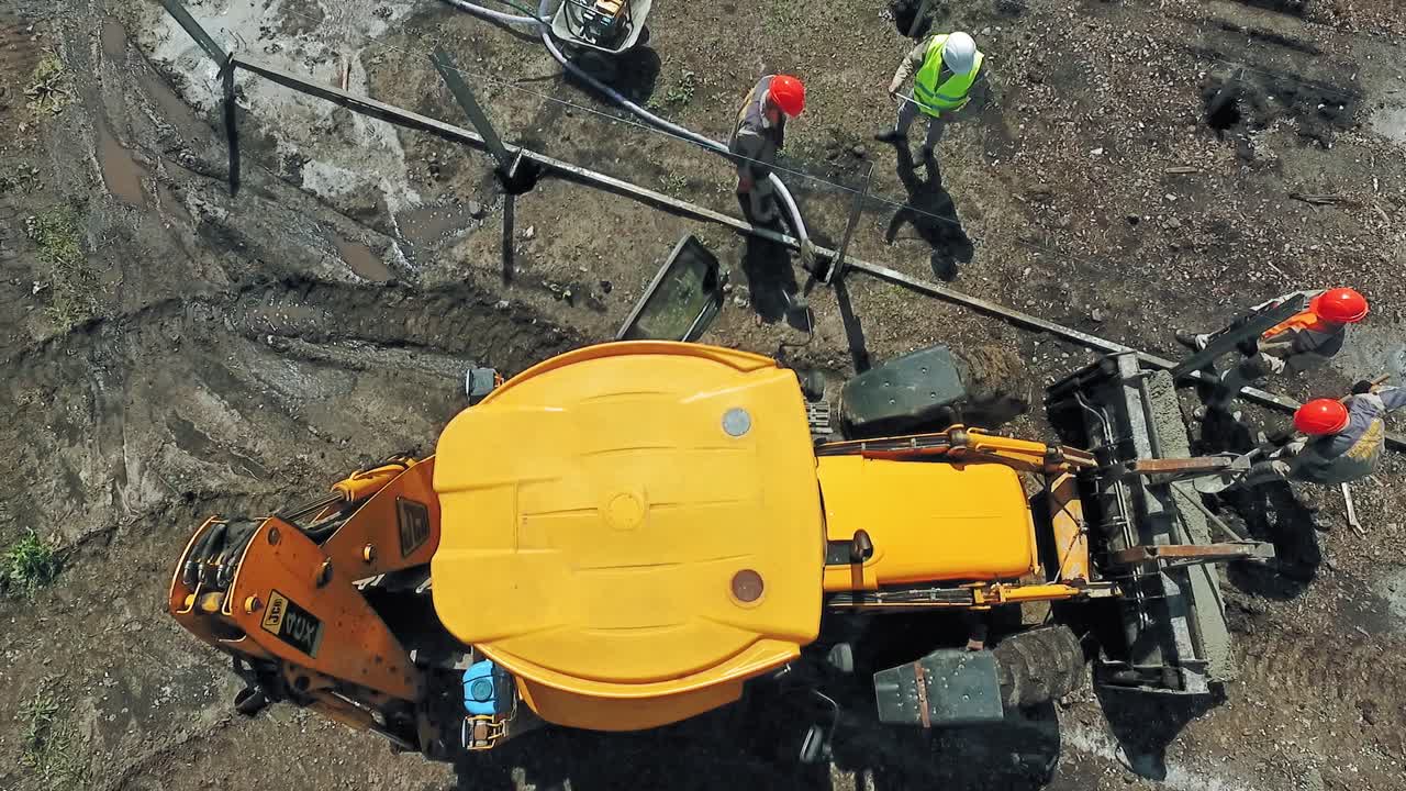 Top view of construction site. Aerial top down view of machinery working at construction site
